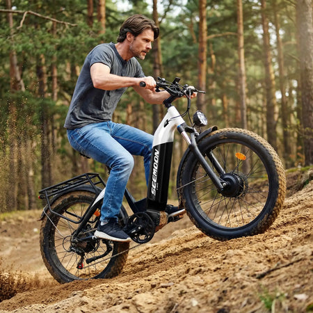 Riding Seemoon SM1 electric bike on a forest trail