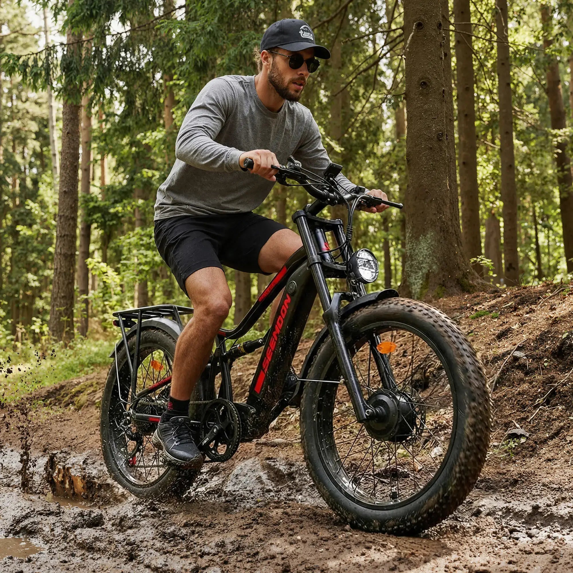 Seemoon SM8 electric bike riding through muddy off-road terrain